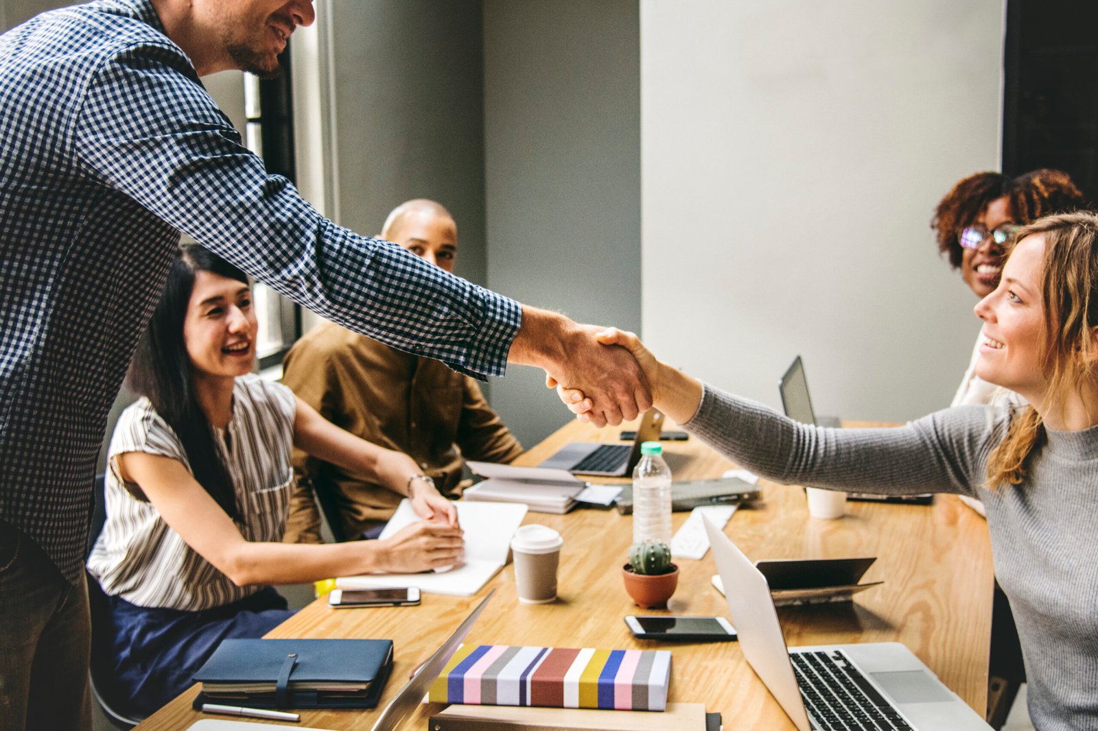 Investors shaking hands on an agreement